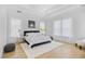 Bright main bedroom featuring tray ceilings, hardwood floors, and abundant natural light at 2313 Summersweet Ln., Myrtle Beach, SC 29579