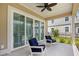 Inviting covered patio with comfortable seating, perfect for enjoying the outdoor views at 2313 Summersweet Ln., Myrtle Beach, SC 29579