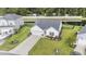 Beautiful aerial view of the home showing the well manicured lawn and proximity to the water at 247 Grove Park Grove Park Loop, Murrells Inlet, SC 29576