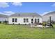 Backyard features a well-manicured lawn with fenced perimeter at 247 Grove Park Grove Park Loop, Murrells Inlet, SC 29576