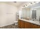 Well-lit bathroom featuring double vanity, granite countertops, and modern fixtures at 247 Grove Park Grove Park Loop, Murrells Inlet, SC 29576