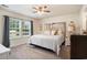 Cozy bedroom with natural light, a decorative headboard, and comfortable furnishings at 247 Grove Park Grove Park Loop, Murrells Inlet, SC 29576