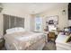 Bright bedroom featuring a decorative headboard, vanity, and plenty of natural light at 247 Grove Park Grove Park Loop, Murrells Inlet, SC 29576