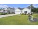 Charming one-story home with a well-maintained lawn, a two-car garage, and tasteful landscaping at 247 Grove Park Grove Park Loop, Murrells Inlet, SC 29576