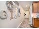 Inviting hallway with decor, light walls, and wood-look flooring, leading into the home at 247 Grove Park Grove Park Loop, Murrells Inlet, SC 29576