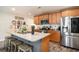 Kitchen featuring granite countertops, stainless steel appliances, and wood cabinets, open to the dining area at 247 Grove Park Grove Park Loop, Murrells Inlet, SC 29576