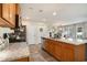Kitchen featuring granite countertops, stainless steel appliances, and wood cabinets, open to the dining area at 247 Grove Park Grove Park Loop, Murrells Inlet, SC 29576