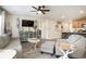 Open-concept living area features stylish furniture, a modern entertainment center, and access to the kitchen at 247 Grove Park Grove Park Loop, Murrells Inlet, SC 29576