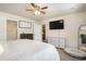 Spacious main bedroom includes a large bed, dresser, and mounted TV for entertainment at 247 Grove Park Grove Park Loop, Murrells Inlet, SC 29576