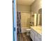 Cozy bathroom featuring a shower-tub combo, vanity with mirror, and wood-look flooring at 2498 Coastline Ct. # 301, Murrells Inlet, SC 29576