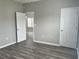 Bedroom showcasing wood-look flooring, neutral paint, and bright natural light at 2498 Coastline Ct. # 301, Murrells Inlet, SC 29576