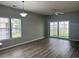 Bright living room with hardwood floors, neutral walls, and lots of natural light at 2498 Coastline Ct. # 301, Murrells Inlet, SC 29576