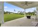 Relax on this covered patio with ample space overlooking a vast backyard featuring a shed and playset at 2554 Dogwood Rd., Longs, SC 29568