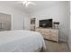 Bedroom with neutral colors, plush carpeting, a dresser with drawers, and a flat screen television at 2554 Dogwood Rd., Longs, SC 29568