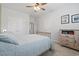 This bedroom boasts neutral carpet, a ceiling fan, and a dresser with decor, creating a relaxing and inviting space at 2554 Dogwood Rd., Longs, SC 29568