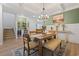 Inviting dining room featuring modern lighting, a bar area, and seamless access to the living spaces at 2554 Dogwood Rd., Longs, SC 29568