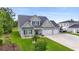 Beautiful two-story home with a three-car garage and landscaped front yard at 2554 Dogwood Rd., Longs, SC 29568