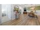 Hallway and dining area with hardwood floors and modern decor at 2554 Dogwood Rd., Longs, SC 29568