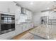 Modern kitchen with stainless steel appliances, granite countertops, and white cabinets at 2554 Dogwood Rd., Longs, SC 29568