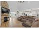 Spacious living area with fireplace, modern lighting, and seamless flow to the kitchen and outdoor spaces at 2554 Dogwood Rd., Longs, SC 29568
