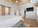 Spacious main bedroom featuring a wood-look ceiling, barn door access to bath, and walk-in closet at 2554 Dogwood Rd., Longs, SC 29568