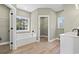 Spacious bathroom featuring a soaking tub, walk-in closets, and a vanity with lots of natural light at 2715 Wood Creek Ln., Conway, SC 29527