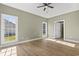 Bright bedroom filled with natural light and featuring neutral walls and modern ceiling fan at 2715 Wood Creek Ln., Conway, SC 29527
