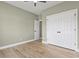 Cozy bedroom with neutral walls, walk-in closet, and sleek wood floors at 2715 Wood Creek Ln., Conway, SC 29527