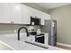 Well-equipped kitchen with stainless steel appliances, countertops and black fixtures at 2715 Wood Creek Ln., Conway, SC 29527
