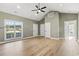 Spacious living area with vaulted ceilings, recessed lighting, a ceiling fan, and wood-look flooring at 2715 Wood Creek Ln., Conway, SC 29527