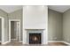 Spacious living room with a modern fireplace feature, complemented by hardwood floors at 2715 Wood Creek Ln., Conway, SC 29527