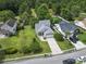 Expansive aerial view of a single-Gathering home with a lush lawn, mature trees, and a long driveway at 2738 Canvasback Trail, Myrtle Beach, SC 29588