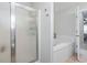 Bathroom featuring a glass enclosed shower and soaking tub, with neutral tile flooring at 2738 Canvasback Trail, Myrtle Beach, SC 29588
