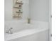 White tiled bath tub, decorated with candles, small plants and a wooden shelf at 2738 Canvasback Trail, Myrtle Beach, SC 29588