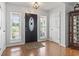 Bright entryway with hardwood floors, decorative front door, and plenty of natural light at 2738 Canvasback Trail, Myrtle Beach, SC 29588