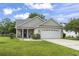 Charming single-story home featuring a well-manicured lawn and a two-car garage at 2738 Canvasback Trail, Myrtle Beach, SC 29588
