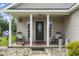 Charming front porch with rocking chairs, hanging plants, and decorative details at 2738 Canvasback Trail, Myrtle Beach, SC 29588