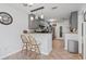 Stylish kitchen features gray cabinets, tile floors, and breakfast bar with seating at 2738 Canvasback Trail, Myrtle Beach, SC 29588