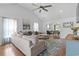 Bright and spacious living room with vaulted ceiling, hardwood floors, and comfortable sectional sofa at 2738 Canvasback Trail, Myrtle Beach, SC 29588
