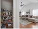 Open pantry full of food, spacious living room with large couch, fan and decor at 2738 Canvasback Trail, Myrtle Beach, SC 29588