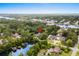 Stunning aerial view of a home nestled among lush trees and waterways, with ocean view in the distance at 280 Morgan Ave., Little River, SC 29566
