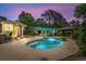 A serene backyard featuring a sparkling pool and a cozy gazebo, perfect for outdoor enjoyment at dusk at 280 Morgan Ave., Little River, SC 29566