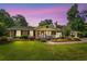 Charming single-story home with a brick facade, manicured lawn, and a welcoming front porch at 280 Morgan Ave., Little River, SC 29566