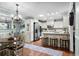 Well-equipped kitchen featuring white cabinets, stainless steel appliances, and a cozy breakfast bar at 280 Morgan Ave., Little River, SC 29566