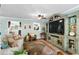 Inviting living room boasts a large TV, comfortable seating, and a decorative rug at 280 Morgan Ave., Little River, SC 29566