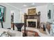 Cozy living room features a decorative fireplace and tile surround at 280 Morgan Ave., Little River, SC 29566