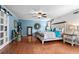 Spacious bedroom with a king size bed, hardwood floors, and decorative lighting at 280 Morgan Ave., Little River, SC 29566