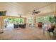 This patio features a vaulted ceiling, tile flooring, and outdoor furniture at 280 Morgan Ave., Little River, SC 29566