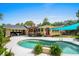 An in-ground backyard pool with an outdoor bar, patio seating, and lovely landscaping at 280 Morgan Ave., Little River, SC 29566