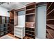 Organized walk-in closet with custom shelving, drawers, and hanging racks for optimal storage at 280 Morgan Ave., Little River, SC 29566